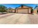 Spacious driveway leading to a two-car garage, surrounded by low-maintenance landscaping at 19206 N 40Th St, Phoenix, AZ 85050