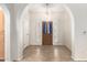 Inviting foyer featuring tile flooring, archways, and a wooden front door with sidelights at 19206 N 40Th St, Phoenix, AZ 85050
