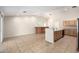 Open kitchen area with a breakfast bar, tile flooring, and ample counter space at 19206 N 40Th St, Phoenix, AZ 85050