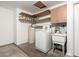 Laundry area in garage with a water heater and washing machine at 19206 N 40Th St, Phoenix, AZ 85050