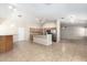Open concept living space with bar, kitchen and living room with tile floor at 19206 N 40Th St, Phoenix, AZ 85050
