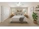 Inviting main bedroom with a ceiling fan, plush bed, matching nightstands, and coordinated decor at 19206 N 40Th St, Phoenix, AZ 85050