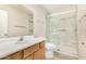 Bathroom featuring single sink vanity and glass enclosed walk-in shower at 2018 N 104Th Dr, Avondale, AZ 85392
