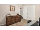Bedroom featuring a wooden dresser and closet with sliding doors at 2018 N 104Th Dr, Avondale, AZ 85392