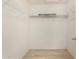 A spacious closet with shelving and light wood floors at 2018 N 104Th Dr, Avondale, AZ 85392