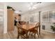 Dining area with wood table, chairs, ceiling fan, and sliding door at 2018 N 104Th Dr, Avondale, AZ 85392
