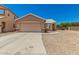 Charming home with two car garage, desert landscaping, and neutral colored exterior at 2018 N 104Th Dr, Avondale, AZ 85392