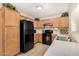 Kitchen with modern appliances, wooden cabinets, and ample counter space at 2018 N 104Th Dr, Avondale, AZ 85392