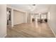 Spacious living area featuring wood-look floors, recessed lighting, and an open concept design at 2018 N 104Th Dr, Avondale, AZ 85392