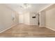 Bright and spacious living room featuring modern flooring and a ceiling fan at 2018 N 104Th Dr, Avondale, AZ 85392