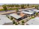 Drone view of a property showing solar panels, desert landscaping, and neighboring houses at 2263 N Trekell Rd # 159, Casa Grande, AZ 85122