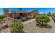 Charming backyard featuring a covered patio, seating, and well-maintained landscaping at 2263 N Trekell Rd # 159, Casa Grande, AZ 85122