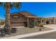 Inviting home featuring a quaint front porch, a convenient carport, and a desert landscape for easy upkeep at 2263 N Trekell Rd # 159, Casa Grande, AZ 85122