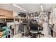 Organized garage space with pegboard, storage shelves and a work area at 2263 N Trekell Rd # 159, Casa Grande, AZ 85122