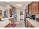 Well-equipped kitchen featuring modern appliances, neutral countertops, and a skylight providing natural light at 2263 N Trekell Rd # 159, Casa Grande, AZ 85122