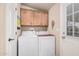Functional laundry room featuring a washer, dryer, and built-in cabinets for storage at 2263 N Trekell Rd # 159, Casa Grande, AZ 85122