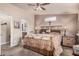 Comfortable bedroom with rustic wooden headboard and ensuite bathroom with double sinks at 2263 N Trekell Rd # 159, Casa Grande, AZ 85122