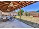 Covered patio with outdoor seating and a spacious backyard, perfect for entertaining at 2324 E Crescent Ave, Mesa, AZ 85204