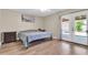 Bedroom features a door to the backyard and wood-look vinyl plank flooring at 2324 E Crescent Ave, Mesa, AZ 85204