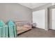 Cozy room with a crib, chair and soft carpet flooring at 2324 E Crescent Ave, Mesa, AZ 85204