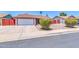 Charming single-story home with a two-car garage and well-maintained landscaping at 2324 E Crescent Ave, Mesa, AZ 85204