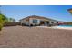 Backyard view of the home features a covered patio and pool area at 24840 S 195Th St, Queen Creek, AZ 85142