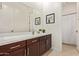 Bathroom with a large mirror, spacious vanity, and a shower with a curtain at 24840 S 195Th St, Queen Creek, AZ 85142