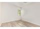 This bedroom has sleek, modern laminate flooring and a bright window with blinds at 24840 S 195Th St, Queen Creek, AZ 85142