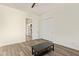 Bedroom features wood floors, neutral walls, and a closet with paneled doors at 24840 S 195Th St, Queen Creek, AZ 85142