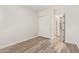 Bedroom with laminate flooring, closet with sliding doors, and neutral wall color at 24840 S 195Th St, Queen Creek, AZ 85142