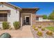 Inviting entrance with stone accents, desert landscaping and a secure gate for added privacy and curb appeal at 24840 S 195Th St, Queen Creek, AZ 85142