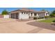 Beautiful single-story home featuring a two-car garage and well manicured landscaping in the front yard at 24840 S 195Th St, Queen Creek, AZ 85142