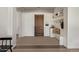 Elegant foyer featuring a custom bench with shelves and a view of the front door and tiled floors at 24840 S 195Th St, Queen Creek, AZ 85142
