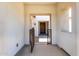 View through arched opening in foyer showing secure gate and detailed wood front door at 24840 S 195Th St, Queen Creek, AZ 85142