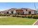 Well-maintained front yard with a beautiful lawn, manicured landscaping, and an inviting entrance to the home at 24840 S 195Th St, Queen Creek, AZ 85142