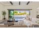 Bright living room with sliding glass doors, seamlessly connecting the indoors with a refreshing outdoor pool at 24840 S 195Th St, Queen Creek, AZ 85142