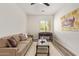 Comfortable living room with modern decor, a cozy couch, and a foosball table at 24840 S 195Th St, Queen Creek, AZ 85142
