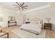 Bright and airy main bedroom featuring a ceiling fan and neutral tones at 24840 S 195Th St, Queen Creek, AZ 85142