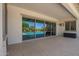 Spacious covered patio area with tiled flooring and expansive views of the pool at 24840 S 195Th St, Queen Creek, AZ 85142