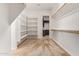Spacious walk-in closet with carpet, shelves, and rods for ample storage at 24840 S 195Th St, Queen Creek, AZ 85142
