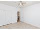 Neutral bedroom featuring tile flooring, and closet with sliding doors at 2527 E Remington Pl, Chandler, AZ 85286