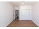 Bedroom featuring tile flooring, closet with sliding doors, and neutral paint at 2527 E Remington Pl, Chandler, AZ 85286