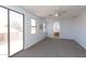 Large bedroom with outdoor access, a ceiling fan, and an ensuite bathroom at 2527 E Remington Pl, Chandler, AZ 85286