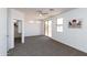 Bright bedroom with ample space, featuring a ceiling fan, outdoor access and walk-in closet at 2527 E Remington Pl, Chandler, AZ 85286