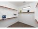 Walk-in closet providing ample storage and organization with multiple shelves and carpeted floors at 2527 E Remington Pl, Chandler, AZ 85286