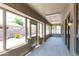 Enclosed patio with tile flooring provides lots of natural light through large windows at 2527 E Remington Pl, Chandler, AZ 85286