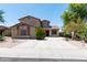 Charming two-story home featuring a well-maintained front yard and long driveway at 2527 E Remington Pl, Chandler, AZ 85286