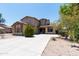 Charming two-story home featuring a well-maintained front yard and long driveway at 2527 E Remington Pl, Chandler, AZ 85286