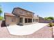 View of the home's covered patio, small second story balcony, and spacious patio at 2527 E Remington Pl, Chandler, AZ 85286