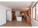 Spacious kitchen featuring stainless steel appliances, wooden cabinetry, and a kitchen island at 2527 E Remington Pl, Chandler, AZ 85286